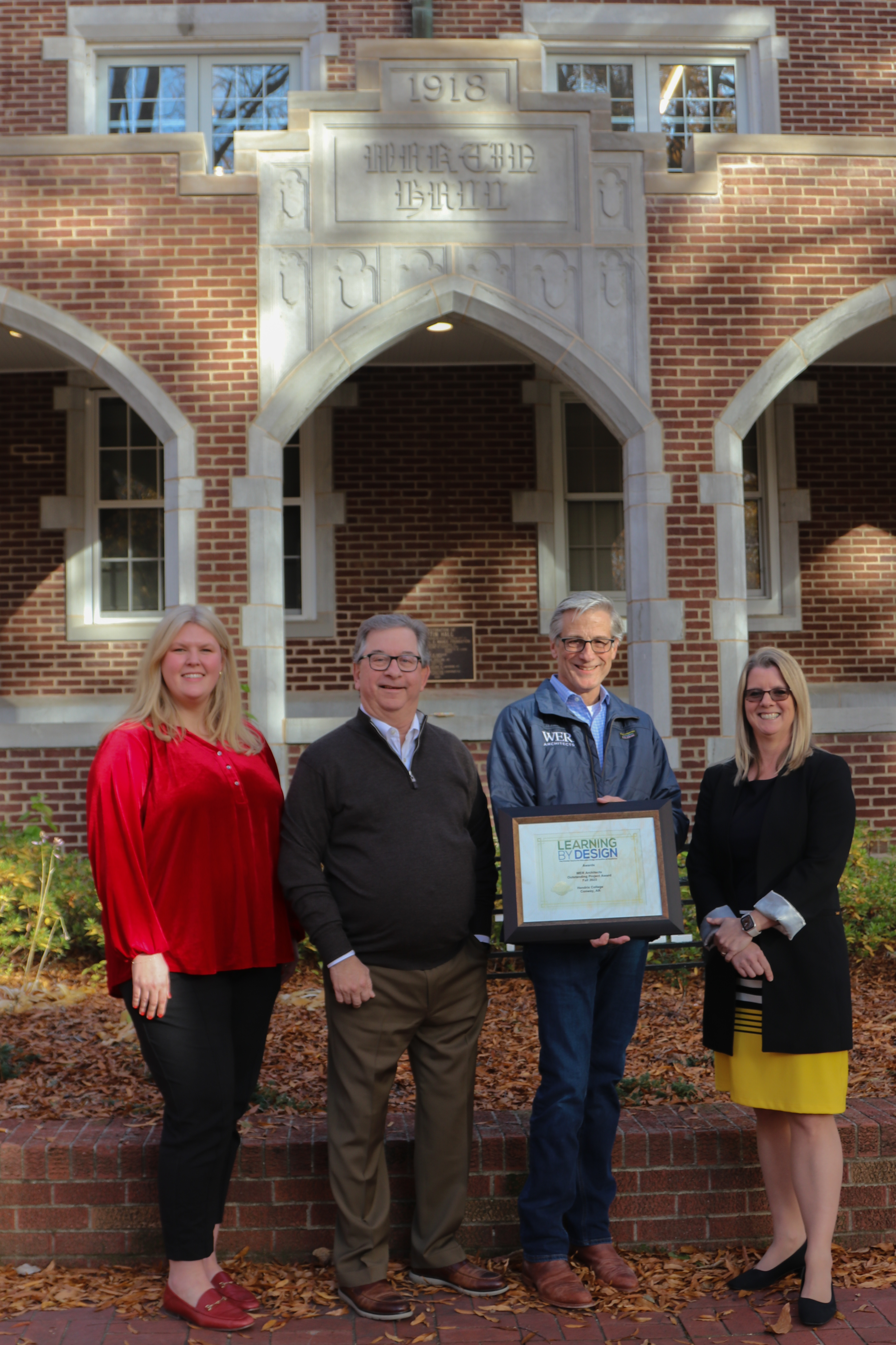 Leaders from Hendrix College and WER Architects gathered on December 12 to celebrate the state and national honors that recent residence hall renovation projects have received. From left: Greer Veon, Hendrix College Director of Residential Life; Ellis Arnold, President Emeritus of the College; John Greer, Principal, WER Architects; and Karen Petersen, President of the College.